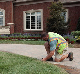 a Hamilton irrigation contractor is checking a riser