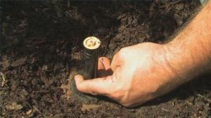 an irrigation repair tech changes out a riser